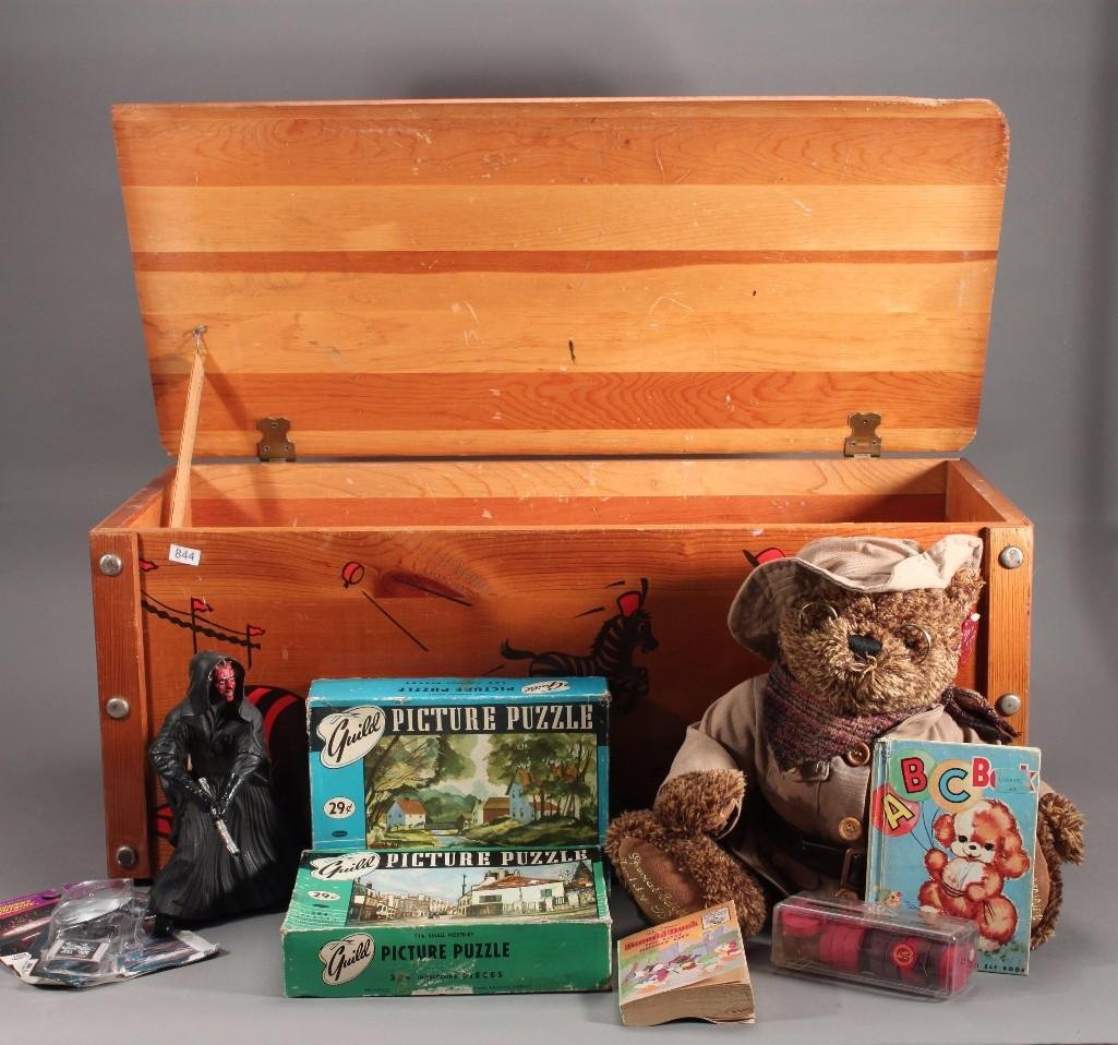 Vintage Wood Toy Box with Contents: Circus themed toy box measures 12.5"x30"x15", has some damage to the right corner of lid. Contents include: Dan Dee Collectors Choice 100th Aniversary teddy bear, star wars figurine, children books, w