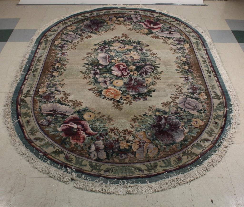 Oval Flower Printed Rug: Gabbeh Collection Oriental Weavers made in Egypt 100% Olefin 6.7"x9.5'', Oval shaped rug shows signs of wear and age.