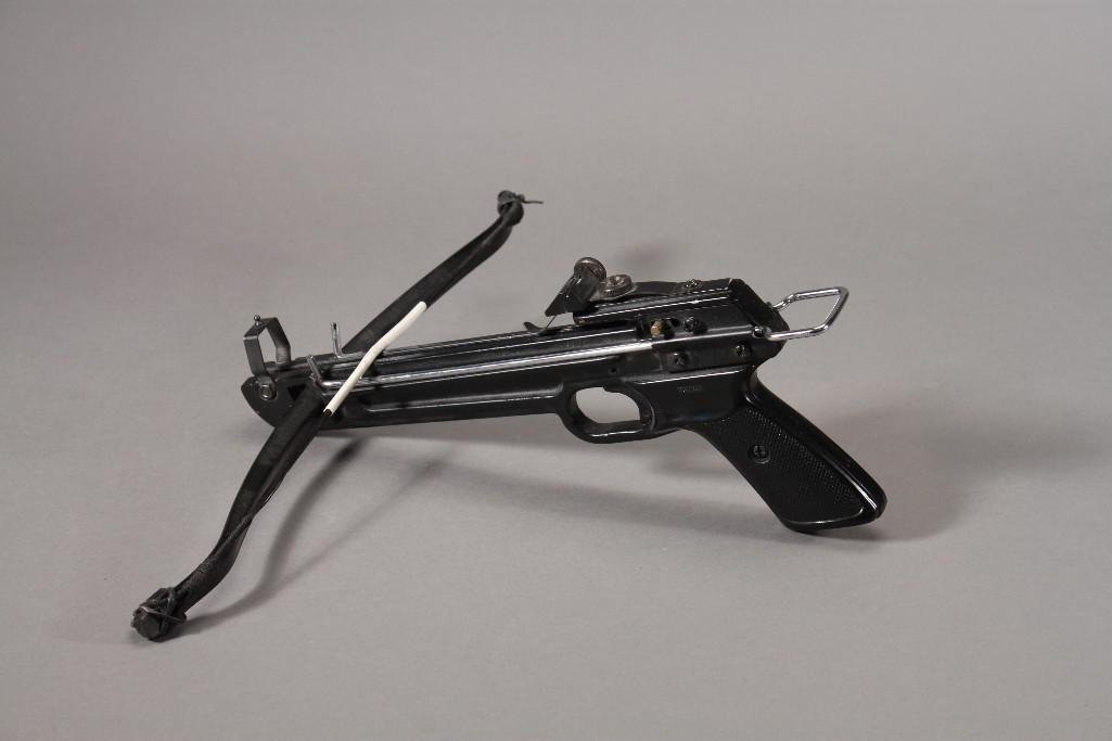 Cross Bow Gun and A Starter Gun (2): Possibly a track and field Starter gun marked ''R'' made in Italy, shows signs of age and wear and a Cross bow gun made in Tawain, no marks. Good condition.