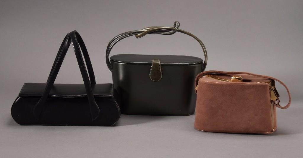 Vintage Ladies Box Handbags (3): Theodore California green box bag measures 9x5x4'', brown suede box bag with gold tone trim measures 7x4.5x4'', Ronay black box bag with matching coin purse measures 10x3x9''. Good condition