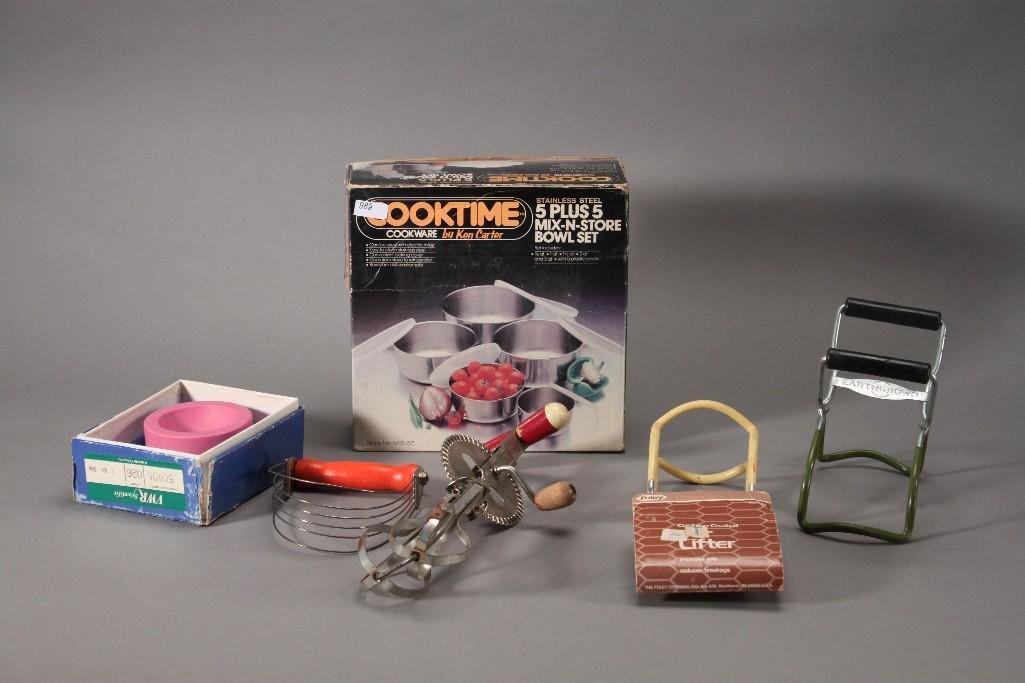Kitchenware: CookTime Cookware by Ken Carter 5 plus 5 mix n store bowl set, two cushion coated jar lifters, hand operated beater, a pink mortar and pestle with a 3.5'' diameter. 