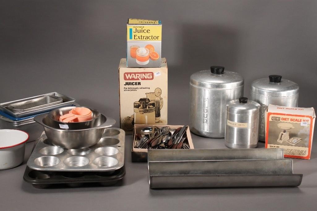 Kitchenware: Waring juicer NIB, juice extractor NIB, cupcake baking pans, baking trays, diet scale kit NIB, flatware, and much more.