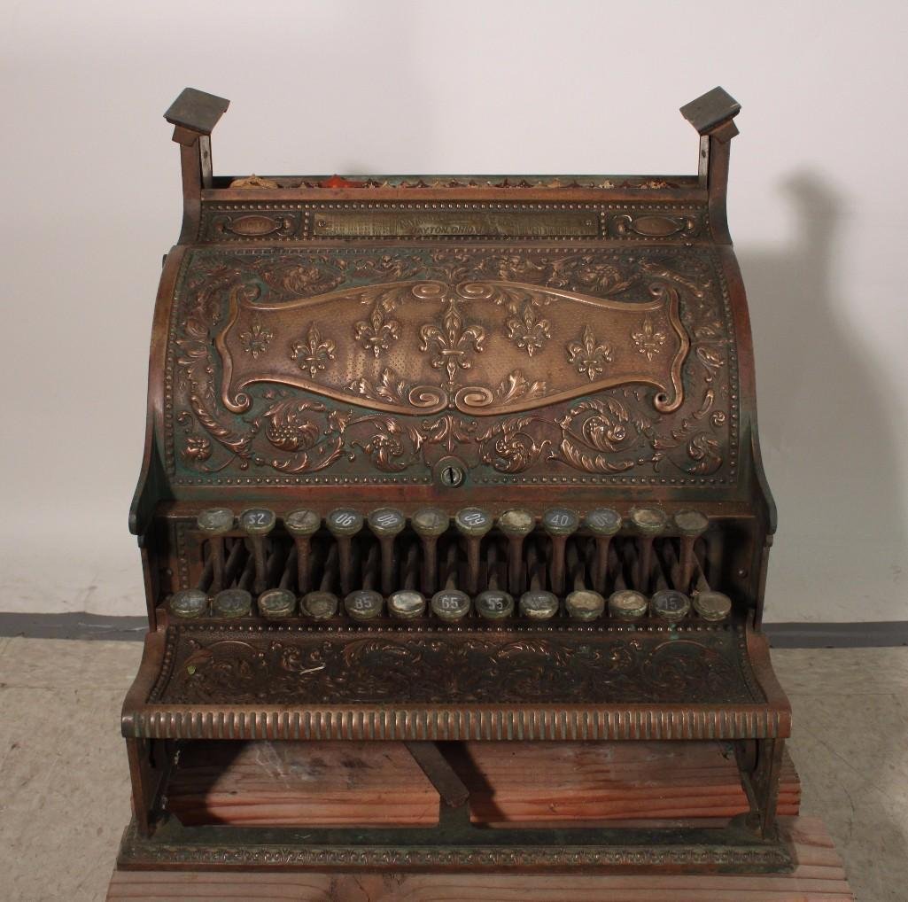 Vintage National Cash Register: Brass with copper finish, early 1900's, metal plates marked 107271 and 33. Keys are frozen, missing drawer and top glass, some missing numbers. Measures 15.5" wide, 16.5" tall.
