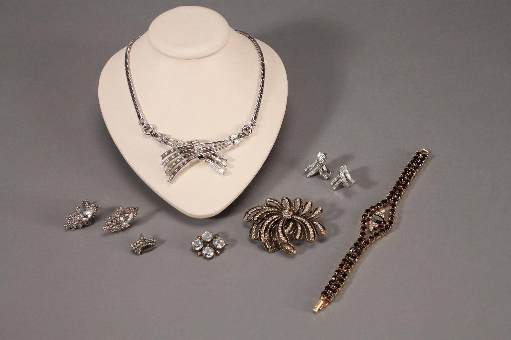 Vintage Women's Costume Jewelry (10): Silver tone Trifari rhinestone necklace (missing two stones), Trifari rhinestone earrings, broken rhinestone brooch, gold tone and black rhinestone bracelet, and more.