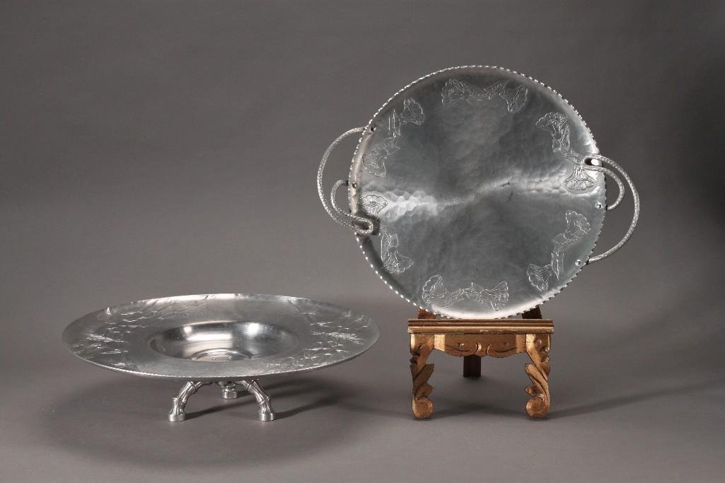 Forged Aluminum Serving Trays (2): Three footed Everlast forged lazy susan 17.5'' wide and 4.5'' tall and a Wrought Farberware serving tray 18'' from handle to handle, Both in good condition.