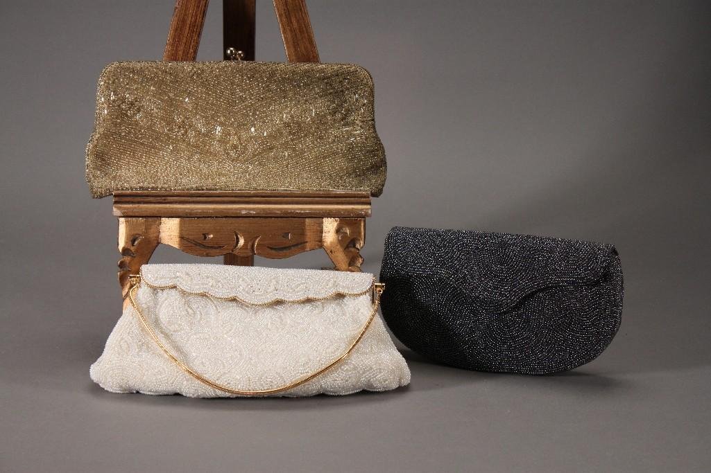 Vintage Beaded Handbags (3): White beaded handbag include a pair of white gloves, made in Japan purse, gold beaded clutch bag marked Made in Japan, and a gray beaded handbag marked made in Belgium by Walborg. In good conditi