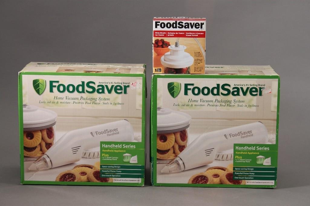 Food Saver System (3): Two Food savers handheld series food saver vacuuming system and a food saver jar sealer. All items are new in original packaging.