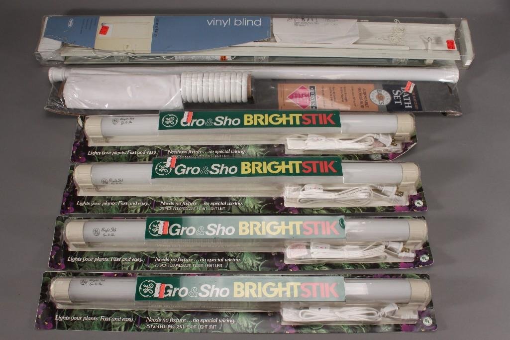 Grow Lights and Home Goods (6): Four GE Gro & Sho bright stik 33 watt grow lights, a Basics Trend bath set, and a 34x64'' vinyl blind set. All items are new in original packaging.