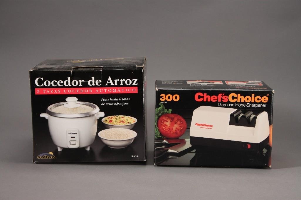 Rice Cooker and Knife Sharpener (2): Chefs Choice diamond hone sharpener model no 300 and a 3 cup automatic rice cooker. Both items are new in original packaging.