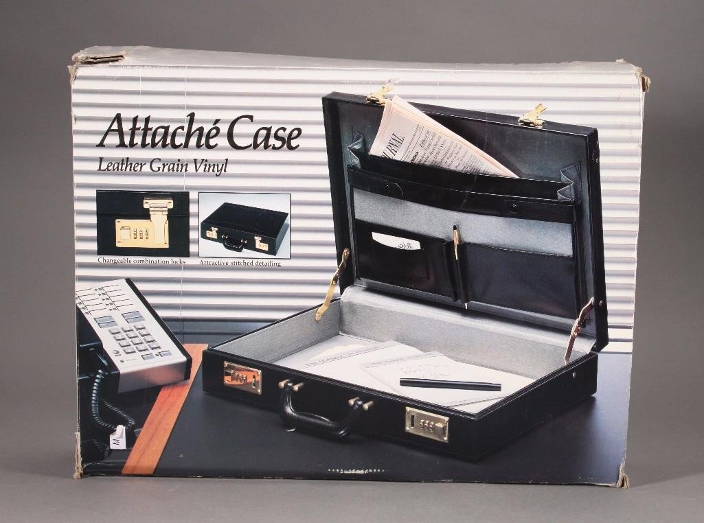 Attache Case: NIB, Leather and vinyl case has changeable combination locks, 17.5" x 12.5" x 3.25"