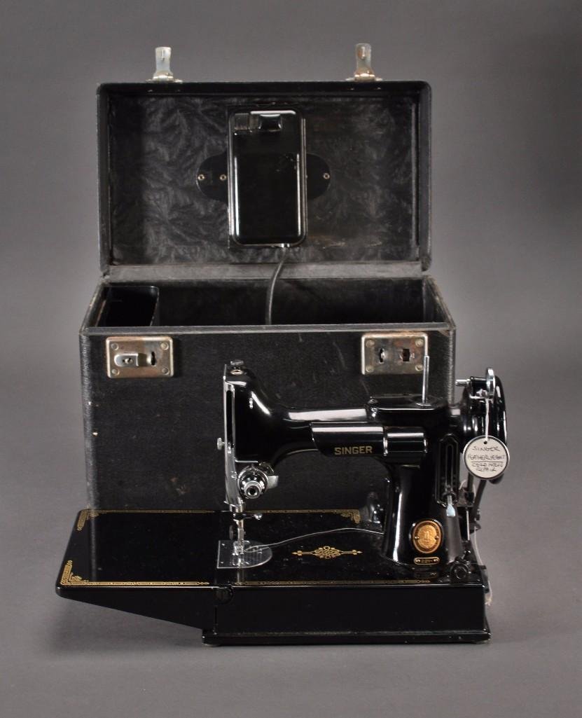 Singer Featherweight Sewing Machine: Runs, controller works, includes pedal, and cord needs repair, 3-120. Includes carrying case (one latch needs repair) shows age and wear.