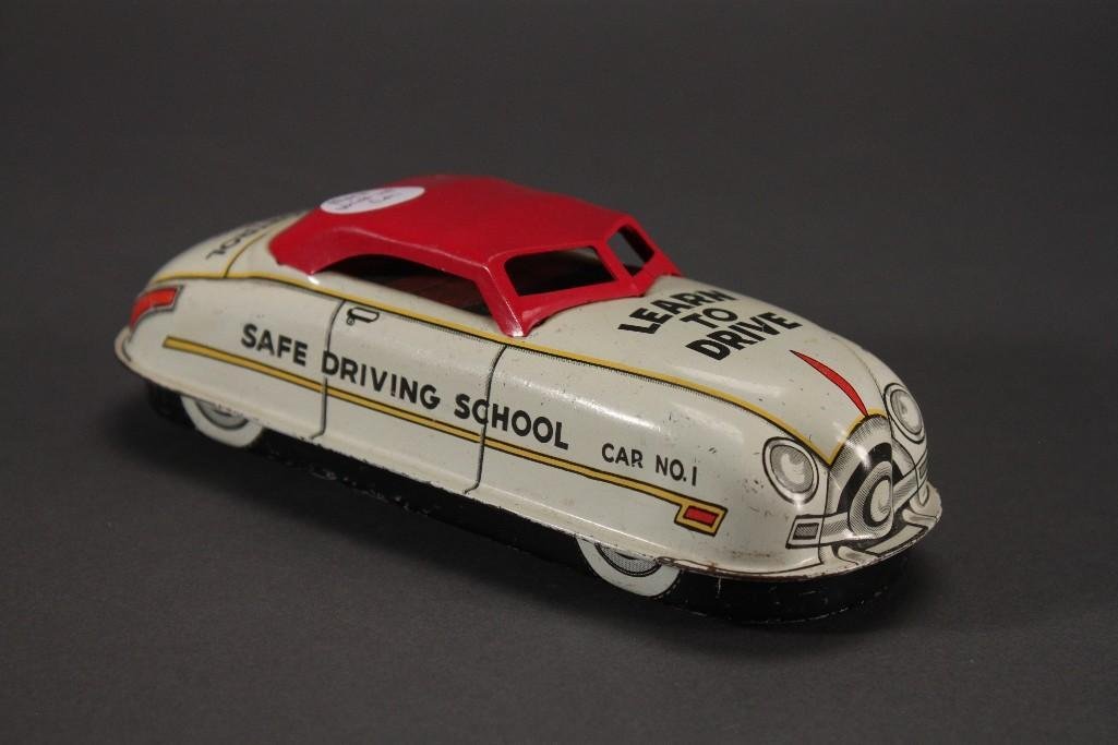 Marx Wind Up "Learn to Drive" Toy Car: Marked Car No. 1, Safe Driving School and Dual Control. 6.5" long, wind up is in working order, show some age but is in good condition.