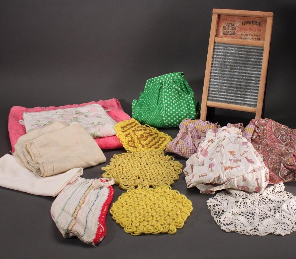 Vintage Aprons and Washboard: Large collection of vintage aprons in various styles and colors, Zing King lingerie washboard and more.