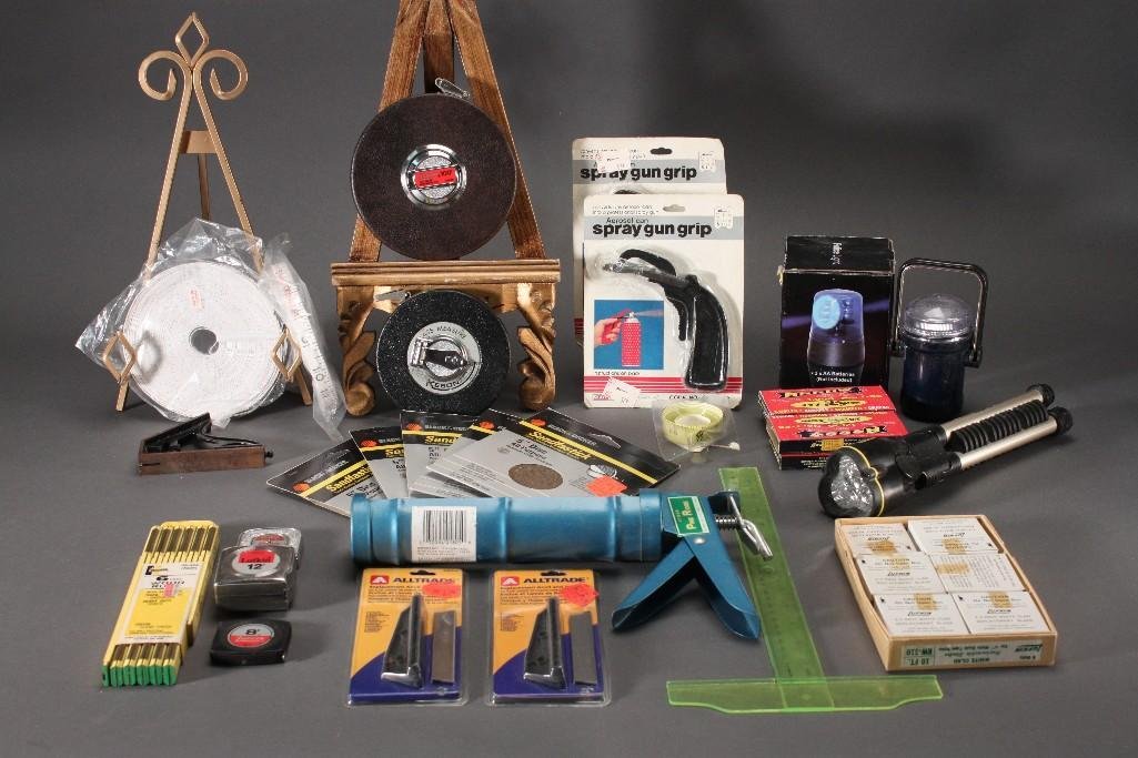 DIY Supplies: Spray gun grips, staples, tripod flashlight, sanding discs, caulking gun, Lufkinmeasuring tape and more.