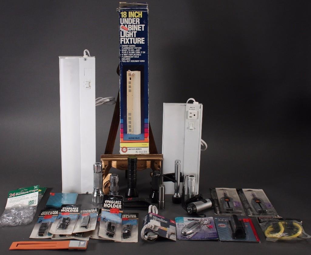 Home Goods: 18 inch under cabinet light fixture, flashlight, eye glass holder, scissors, carb counter, stretch cords, and much more.