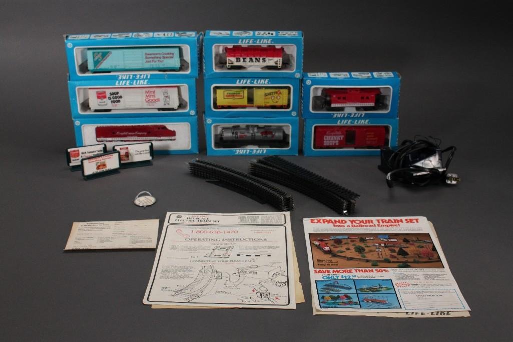 HO Scale Train Cars and Accessories: Electric train set with some tracks, 8 train cars including the Campbellsengine and caboose new in box, has track with some accessories, electric box has Listed 390-J, original paperwork and manual. O