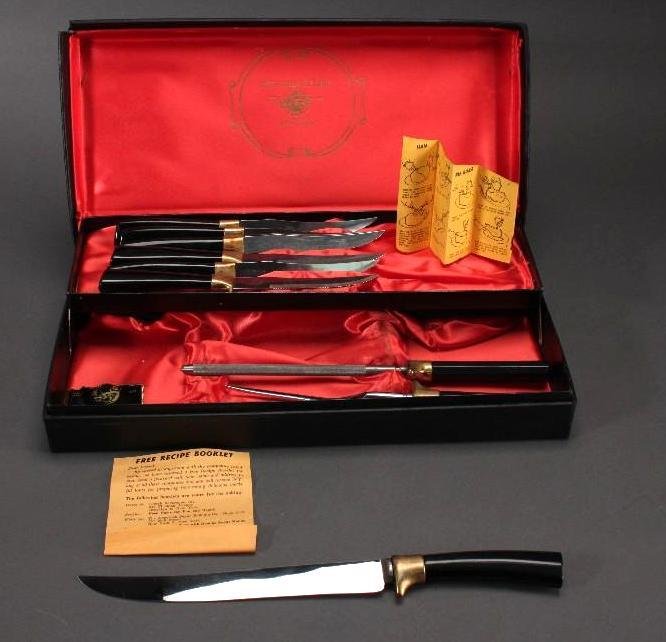 Sheffield Stainless Steel Knives and Serving Pieces: 6 steak knives, serving knife, sharpener, and fork, in box, good used condition.