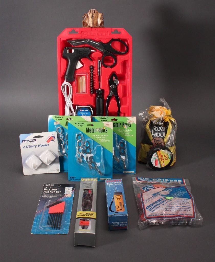 Handtools: Alltradekit includes glue gun, scissors, pliers, and more, sports pocket AM/FM radio, hex key set, utility hooks, and more.