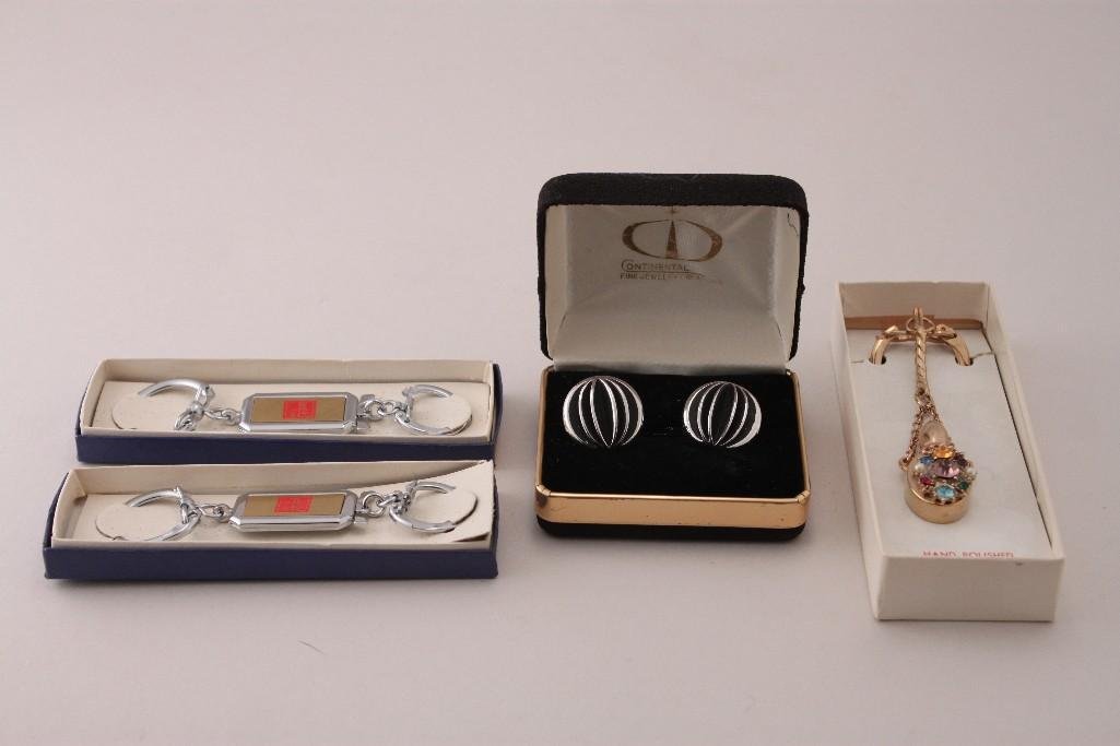 Keychains and Cufflinks (4): Rhinestone encrusted gold-tone perfume bottle keychain, 2 silver-tone keychains, one pair vintage cufflinks, good condition.