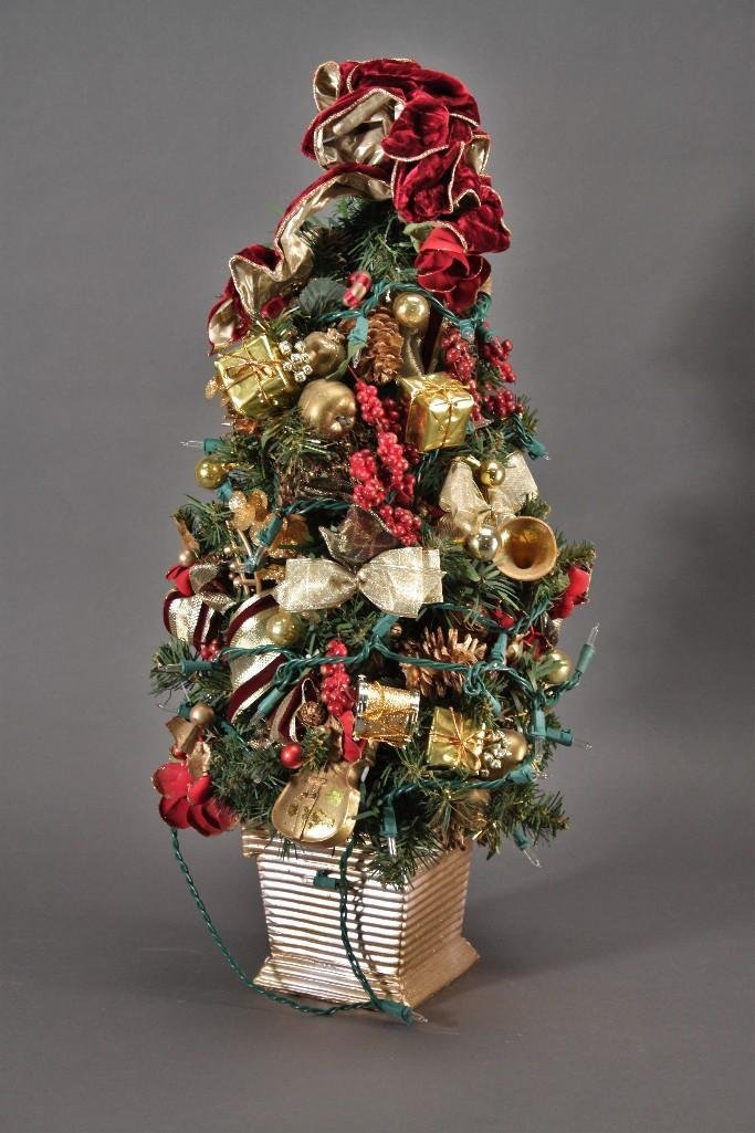 Lighted Christmas Tree: Measures 2 foot tall tree with ornaments and lights.