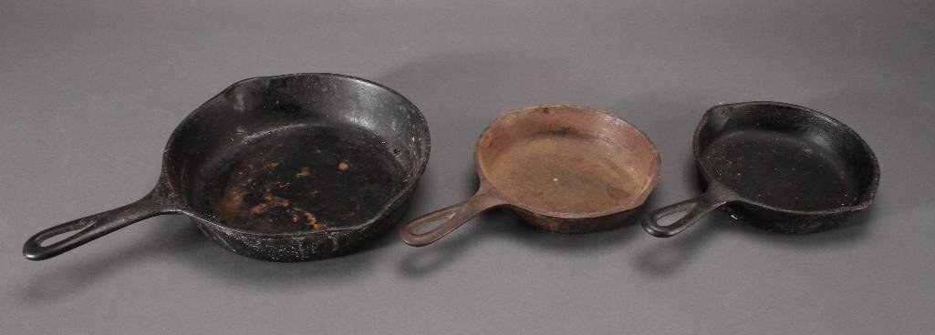 Cast Iron Frying Pans (3): 7" round pan (2) and a 10" pan, one 7" pan marked with a 3 on the bottom, other two are unmarked, all are in used condition