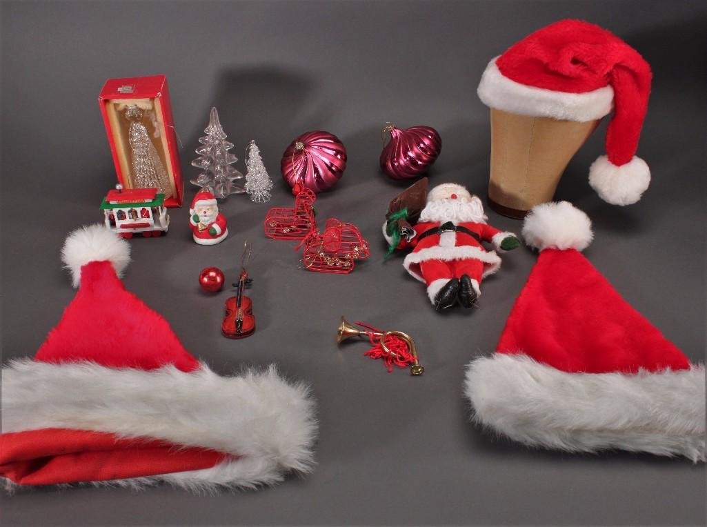 Christmas Decor: Three size small Santa hats in good condition, assorted Christmas tree ornaments, Santa plush doll, and more.