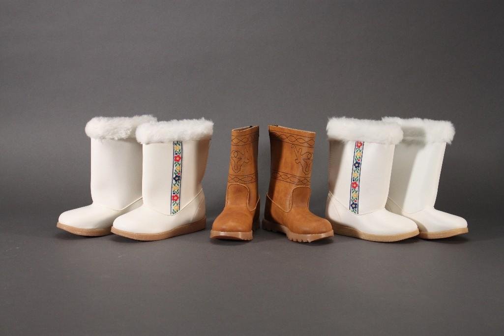 Children's Vintage Boots (3 pair): Two pairs of white boots with faux fur trim and flower detail, size 6 and 7. Tan size 5 boots with embroidered detail. All are in original packaging.