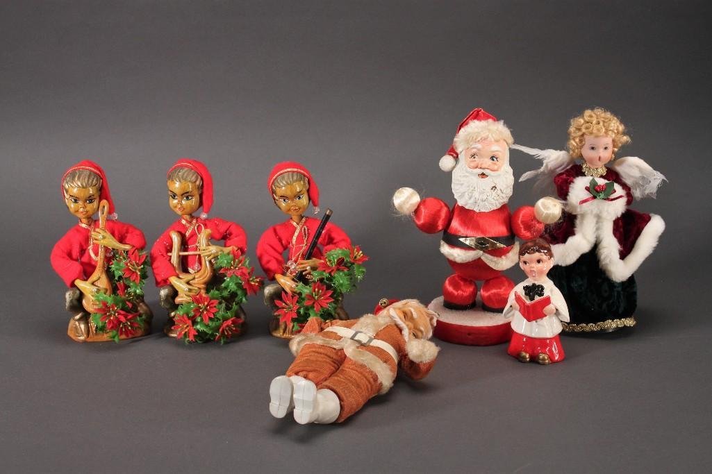 Vintage Christmas Decor (7): 9.5'' angel tree topper, three 7.5'' elf figures, 10'' santa(shows signs of age), ceramic singing child figure, and more.