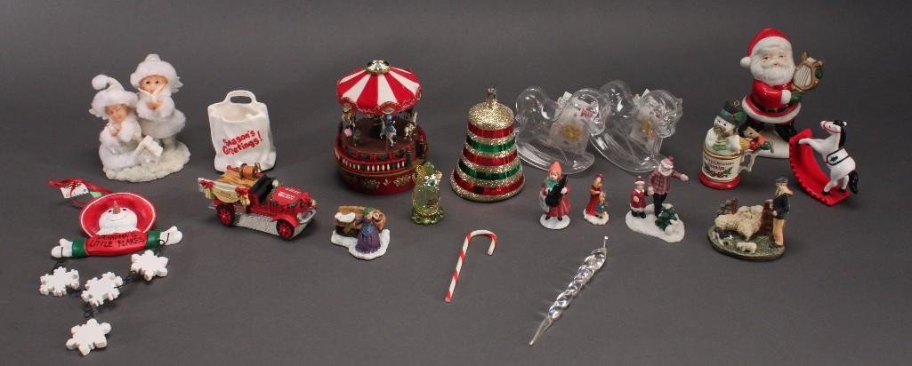 Christmas tree ornaments and figurines: 4.5inch tall Ceramic Santa figurine, 5 inch tall musical carousel, Coca Cola Town Square 1994 collection fire truck figurine, Snowman tree ornament and more.