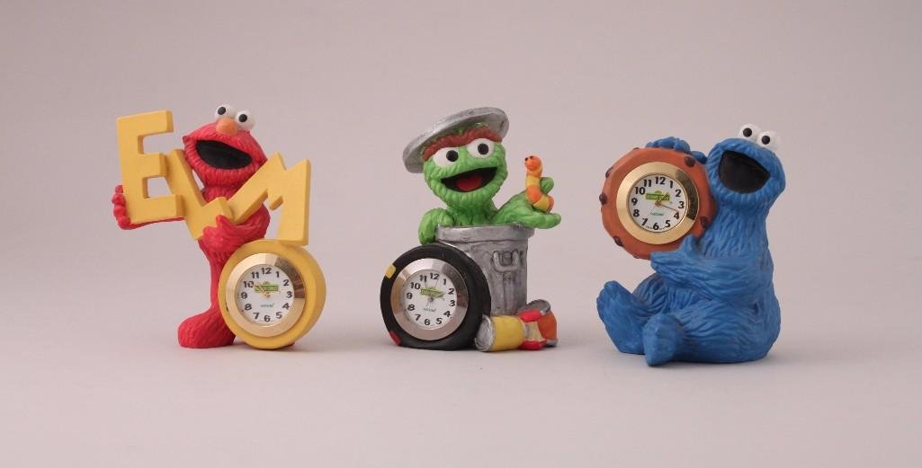 Henson Sesame Street Desk Clocks (3): Novelty Desk clocks: 3" Elmo, 2.5" Grover, 3" cookie Monster, all are in good condition and marked Henson China