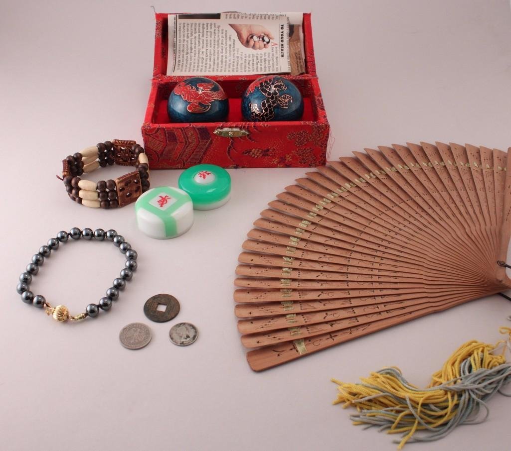 Asian Accessories and Collectibles: Chinese exercise balls in fabric covered box, small wooden fan with box, coins, and more.