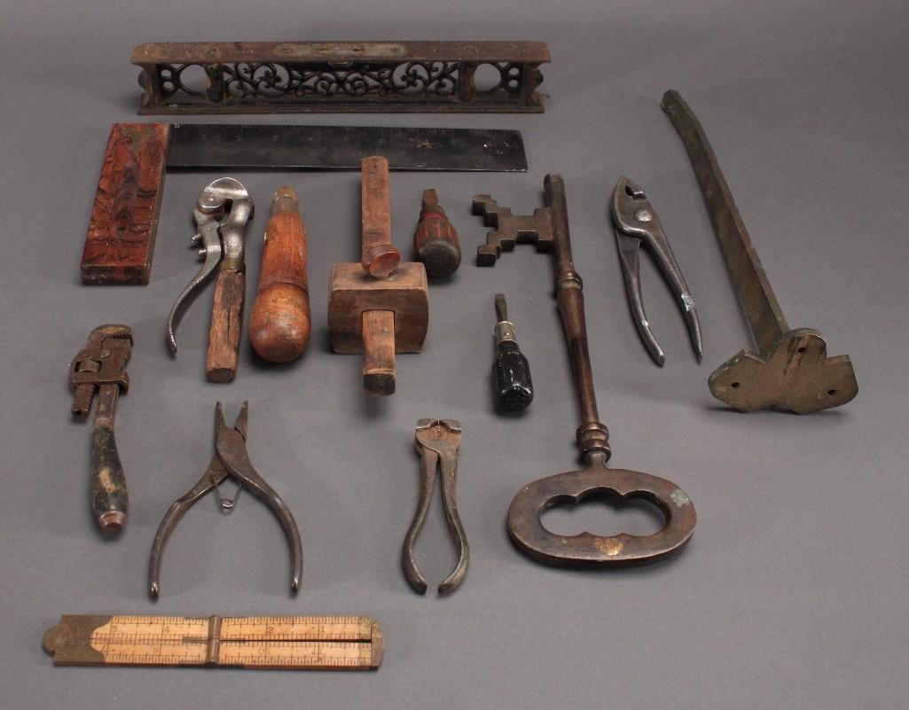 Vintage Tools: Stanley measuring square, wrought iron ornate level, large key (12" long), small wrench, small screw driver, and more.
