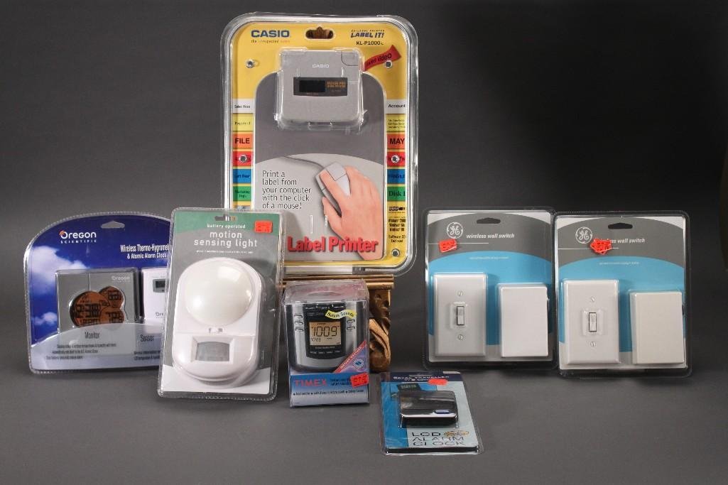 Office Supplies and Home Goods: Casio PC label maker, Timex nature sound alarm clock, motion sensinglight, wireless thermo-hygrometer and LCD alarm clock, and more.