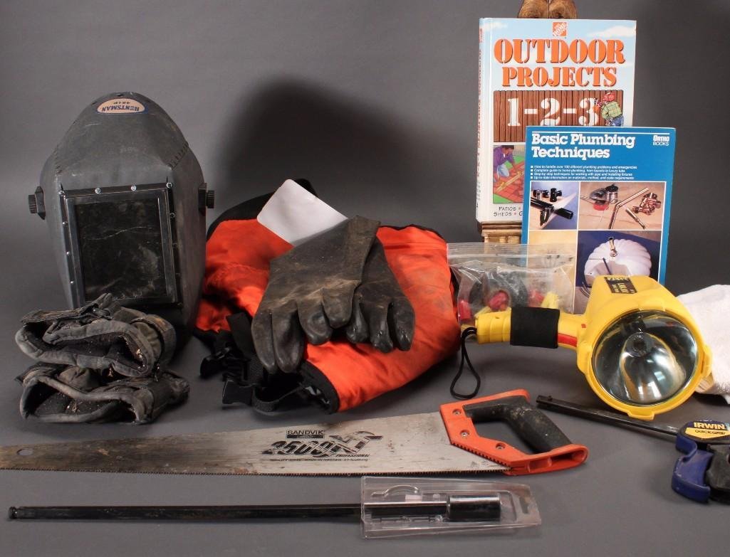 Hardware: Welding face mask, assorted work gloves, The Home Depot outdoor projects 1-2-3 book, heavy duty flashlight, Husqvarnawork pants,and more.