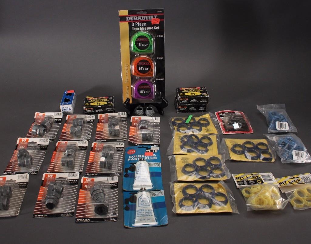 Plumbing Supplies, Staples, and Measuring Tapes: Halex water tight 3/4" connectors (13), Arrow #T59 staples (3), Durabuilt three piece tape measure set, metal stud grommets, and more. Most are in original packaging.