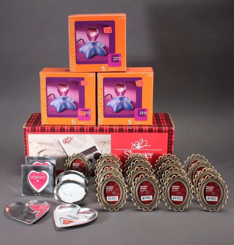 Home Decor: Large lot includes; decorative metal picture frames, three dormroom party light faces, plastic shower curtain, shower set and more.
