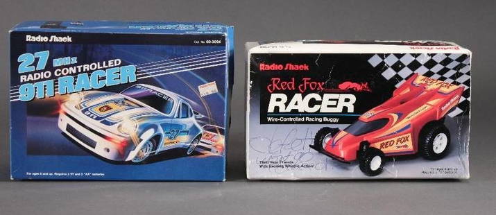 Vintage Radio Shack Wire Control Cars (2): Red Shack Red Fox Racer cat no 60-2308 (box has writing on it) and a 27MHz radio controlled 911 Racer cat no 60-3094 new in original packaging.