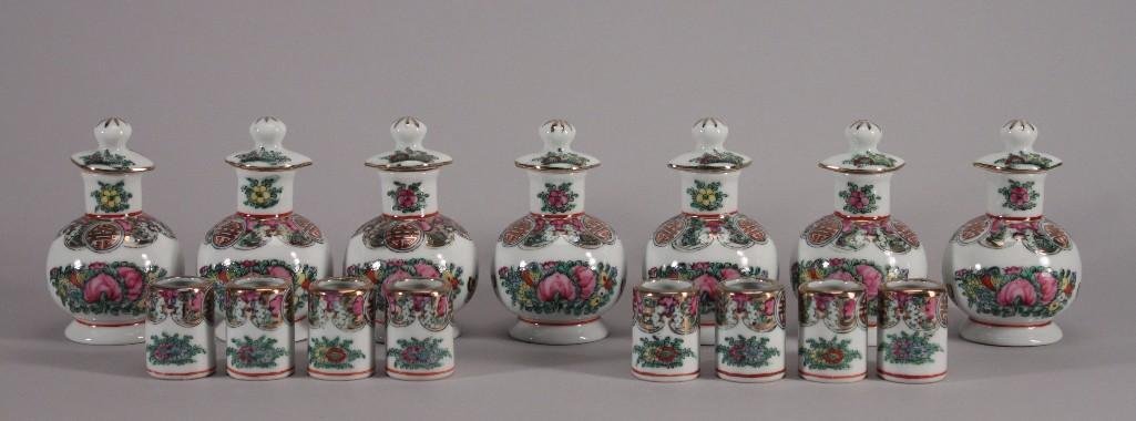 Vintage Soy Sauce Bottles and Cups (15): Asian floraland butterfly design, bottles 4.5'' tall and miniature cups measure 1.5'' tall, in good condition, have an Asian markingon the bottom.
