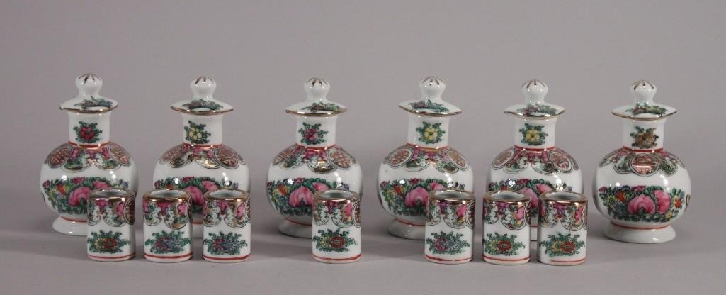 Vintage Soy Sauce Bottles and Cups (13): Asian floraland butterfly design, bottles 4.5'' tall and miniature cups measure 1.5'' tall, in good condition, have an Asian markingon the bottom.