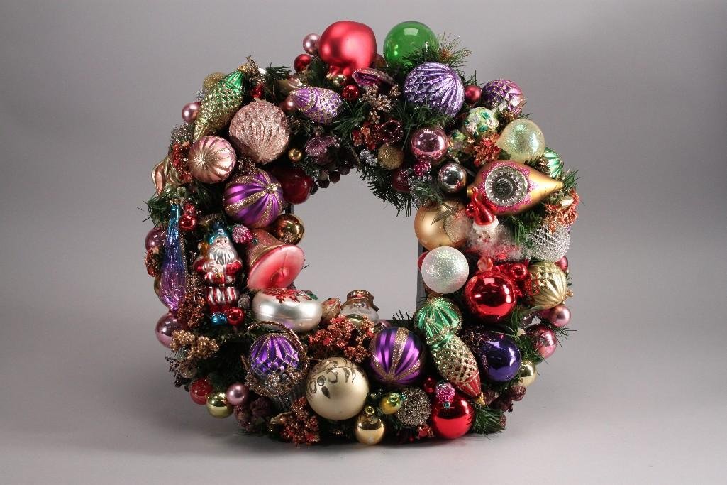 Hand Blown Glass Ornamental Wreath: Beautiful Christmas wreath adorned with glass and plastic ornaments, measures 25" wide, contains Santa ornament that is 6" long, indented5" ornament,and many more. Some broken ornaments but is in othe