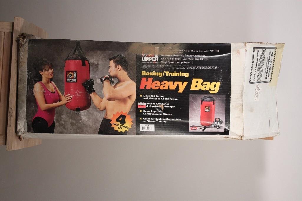 Upper Rank Boxing/Training Heavy Bag: 4 piece combo set, includes door way mounting bar, gloves, 40 lbs bag, and jumprope. In original box. Box shows wear.