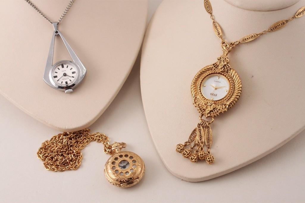 Gold Tone and Silver Tone Watch Pendants on Chains (3): Executive By J.C. gold tone watch pendant on gold tone chain, ''1928" Quartz gold tone watch pendant necklace, and a silver tone Sutton Swiss watch pendant on silver tone chain, items are in good cond