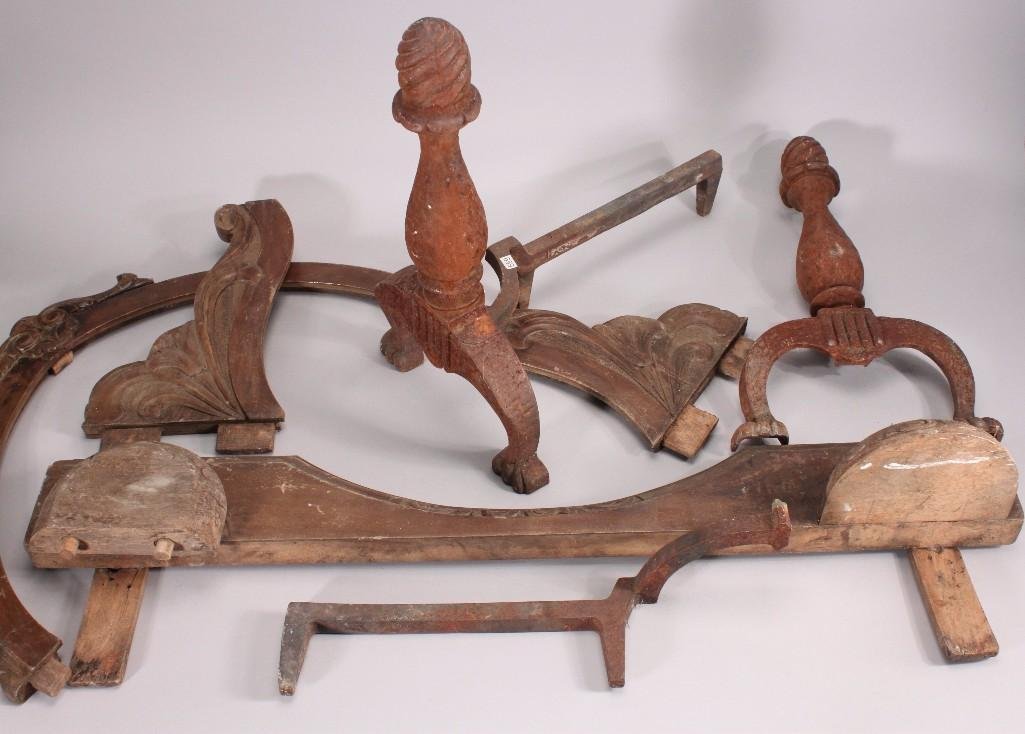 Antique Metal Andirons and Wood Carved Furniture Pieces: Two metal ornate andirons with heavy rust, several antique furniture carved pieces. Shows age and wear.
