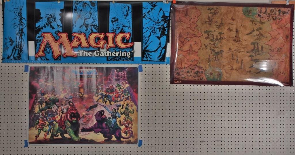 Masters Of the Universe and Magic the Gathering Posters: Laminated Magic the Gathering Champions of Kamigawaposter 36" x 24", a Magic the Gathering banner with four grommet holes for hanging 18" x 48", and a 1984 Masters of the Universe character poster has