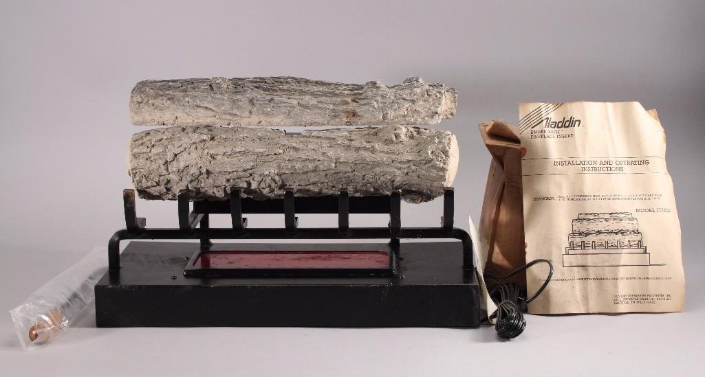Aladdin Ember Brite Fireplace Insert & Accessories: Fireplace insert model no F17000, includes logs, original manual, and rocks. Insert is new.