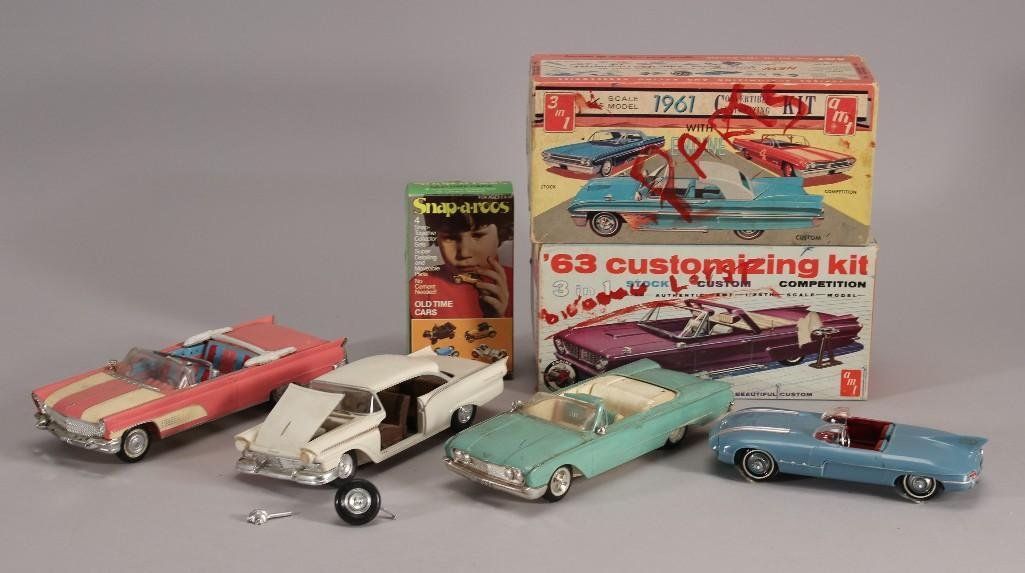 1975 Aurora Snap-A-Roos & Model Cars (7): 1975 Aurora Snap A Roos old time cars in original box, pink Continental model car (shows age and wear), a Pontiac Club De Mer model car on wood in plastic (has damage), and other assorted m
