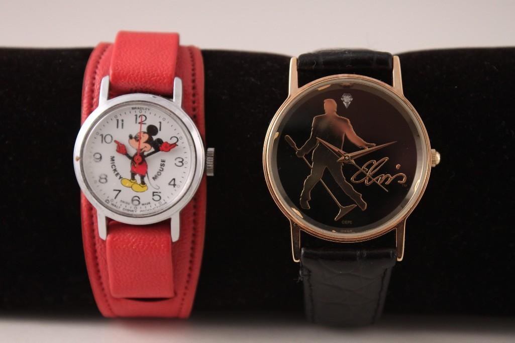 Valdawn Elvis Watch & a Mickey Mouse Watch (2): Valdawn 5451 Elvis Signature product, 2005 Japan movement with black leather band and a Bradley Swiss made Mickey Mouse watch with red vinyl band (band shows wear).
