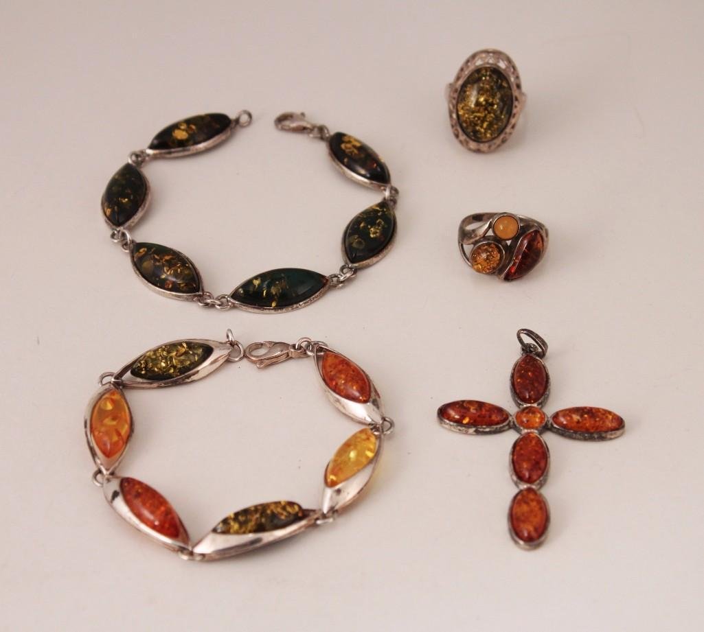 Amber & Sterling Jewelry (5): Nice assortment includes two link bracelets, two amber and sterling rings and one cross pendant.