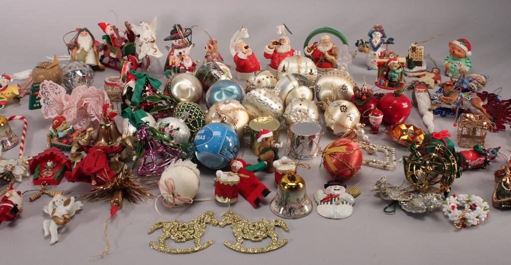 Christmas Ornaments: Large lot includes cloth covered bulbs, bells, Santa in an airplane, vintage elf, ornate mirror, various Coca-Cola ornaments, beaded wreath, "Angel's Prayer" by Dona Gelsinger 29th issue Heavens Littl