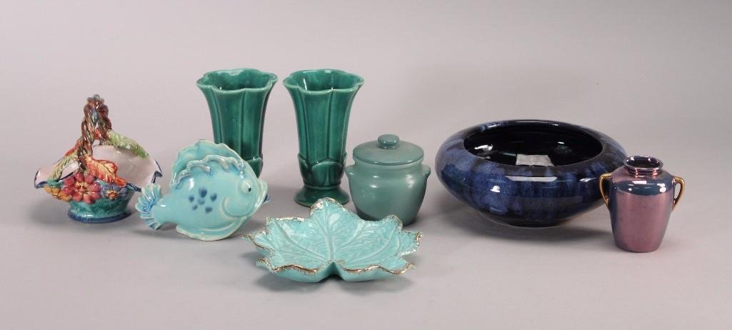 Collectible Pottery (8): Two 5" tall tulip shaped USA vases, leaf shaped tray marked USA 720-C, 3" tallglazed Limoges vase, signed and numbered floral basket, Dutchess CheeseNew York lidded crock, and a made in Japan fish vas